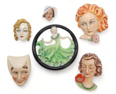 SIX GOEBEL POTTERY WALL MASKS including a circular example with a girl in green dress dancing, FX111, 24cm high, Medieval sty