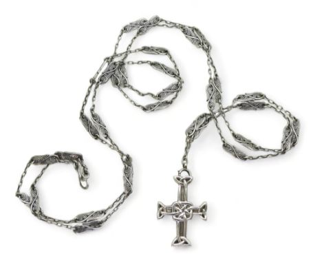 AN ALEXANDER RITCHIE JEWEL the white metal Celtic cross is suspended on a vine pattern long chain. the cross is stamped with 