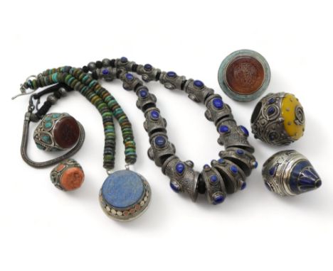 A COLLECTION OF WHITE METAL TRIBAL JEWELLERY from Afghanistan, to include a statement necklace, embossed with flowers, set wi