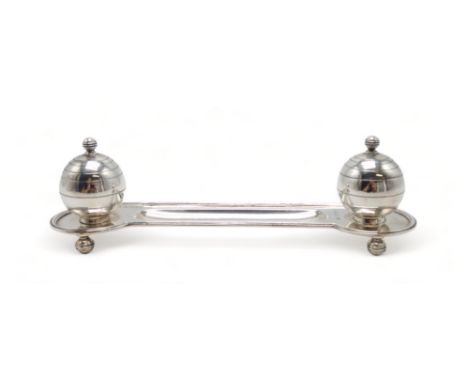 AN ART DECO SILVER INKSTAND by Adie Brothers, Birmingham 1937, of oblong form, with two stylised inkwells of spherical form, 