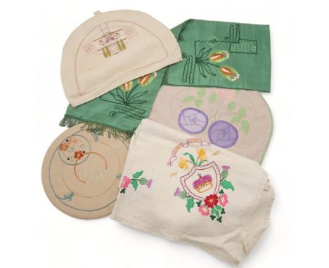 A GLASGOW SCHOOL OF ART TEACOSY embroidered on linen, with a dragonfly, trees and flowers, another embroidered with the Glasg