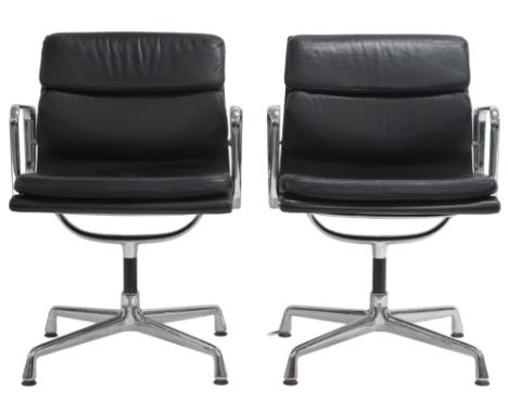 A PAIR OF VITRA EAMES EA 208 SOFT PAD CHAIRS with black soft leather upholstery and chrome open arms rests upon four legs spr