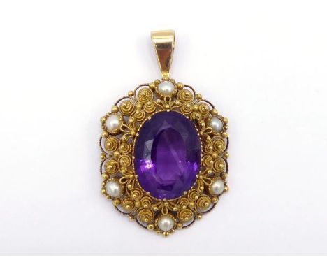 An amethyst and split pearl pendant, in the early 19th century style, the central oval cut amethyst 18 x 13mm, in a cannetill