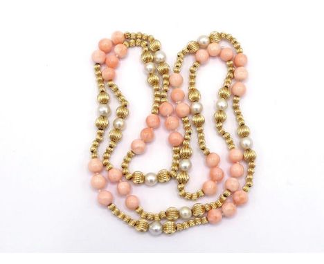 A yellow metal (tests 14 carat gold), coral and cultured pearl necklace, composed of alternating series' of 7.9mm coral beads
