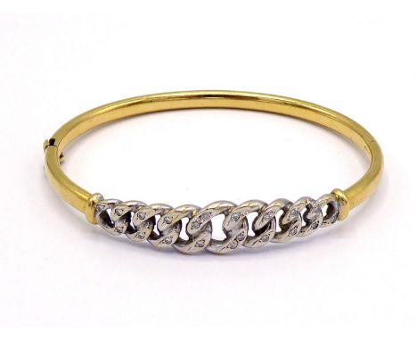 A diamond bangle, the central curb linked motif pave set overall with small brilliants, mounted in white metal, to a yellow m