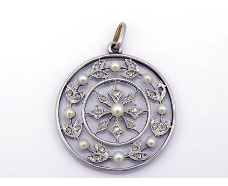 An early 20th century platinum, diamond and seed pearl pendant, composed of a wreath of millgrain set rose cuts and pearls be