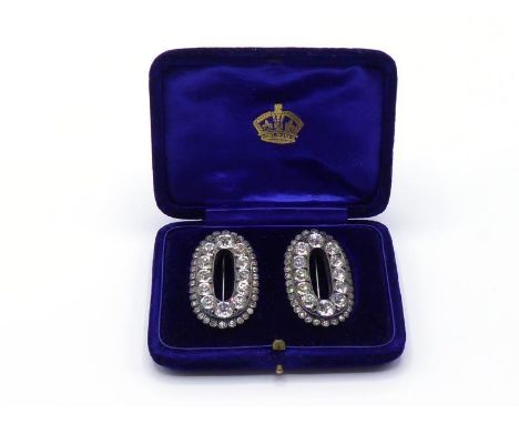 A pair of fine 19th century paste brooches, each oval brooch converted from a shoe buckle, the oval mount pave set with cushi