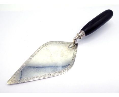 A silver presentation trowel with laurel-engraved border and wood handle, uninscribed, by Mappin & Webb, Sheffield, 1954, 28 