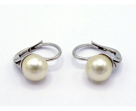 A pair of cultured pearl earrings, each with a 7.3mm off-round pearl, the hook fitting stamped '750', 3.2 gms CONDITION: good