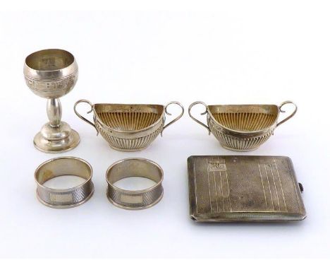 An engine-turned silver cigarette case initialled "ML"; a pair of late Victorian oval half-fluted silver salts, Birmingham, 1