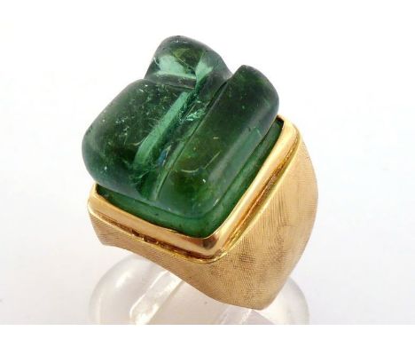 A 1970s 18 carat gold and tourmaline ring by Haroldo Burle Marx, the rectangular free form tourmaline rub over set above a br