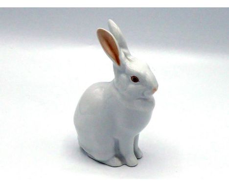 A ceramic seated white rabbit by Herend, with raised ears lined in pink, pink eyes and nose, the blue backstamp on the unders