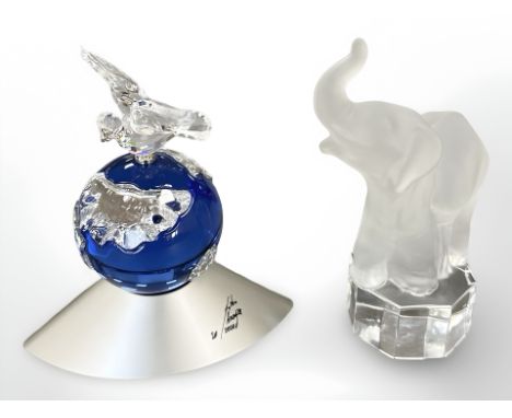 A limited edition coloured crystal Swarovski ornament of a dove on globe, together with a crystal figure of an elephant  