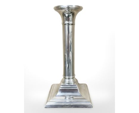 A silver candlestick on square plinth base, height 17 cm. CONDITION REPORT: Base loaded.