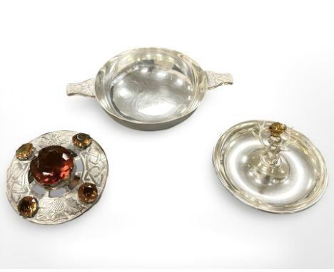 A white metal Scottish kilt brooch, mounted with citrine coloured stones, together with an Ortak porringer and a Scottish whi