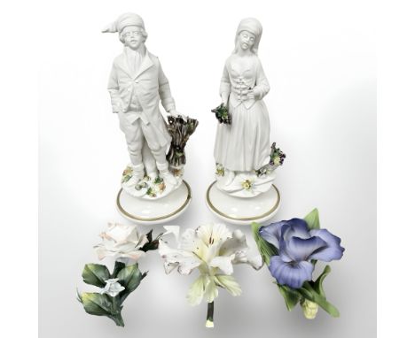 A pair of Capo Di Monte matt glazed figures, height 24 cm, together with two further Capo Di Monte flower ornaments and a Gar