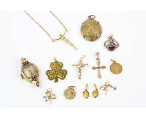 A collection of jewellery, comprising a red stone set watch head, the case stamped '18k', a pendant on chain, stamped '750', 