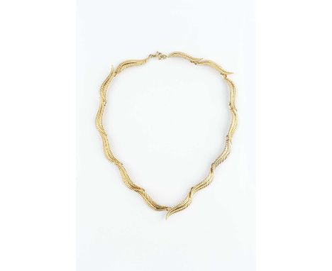 A 9ct gold collar necklace, designed as a series of repeating leaf panels, maker's mark EFC, length 36cmCondition report: Of 