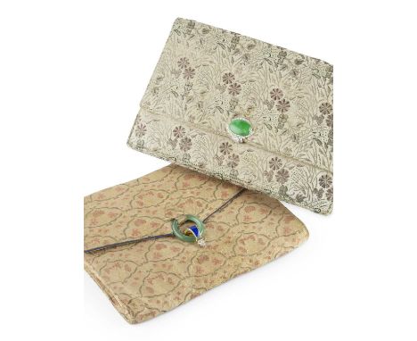 An Art Deco evening bag by Cartier, the brocade fabric bag of envelope design, with a hinged clasp of geometric design, centr