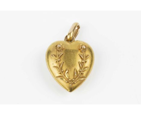 A late Victorian 15ct gold heart pendant, applied with a wreath of flowerheads and foliage, hallmarked for Chester 1896, leng