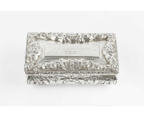 An early Victorian silver rectangular snuff box, the top and shaped sides decorated in relief with flowers and scrolling foli