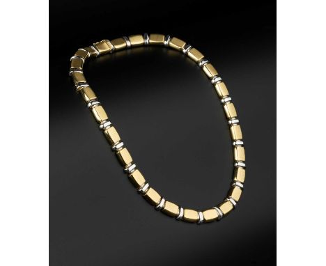 An 18ct two colour gold collar necklace, designed as a series of repeating tonneau-shaped panels of brushed finish, with bar-