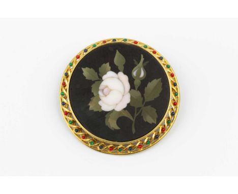 A 19th century pietra dura and enamel panel brooch, the circular panel depicting a pale pink rose bud spray, to an openwork t