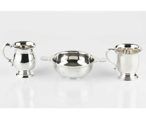 A silver quaich, with plain, slightly shaped handles, by Barker Bros Silver Ltd., Birmingham 1932, 10.5cm diameter, and two s