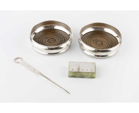 A collection of silver items, comprising a pair of silver mounted wine coasters, London 1971, a silver mounted paperweight by