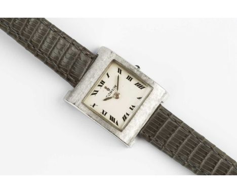 A lady's 'Buckingham' wristwatch by Corum, the square silvered dial with black Roman numerals, to a jewelled manual wind move