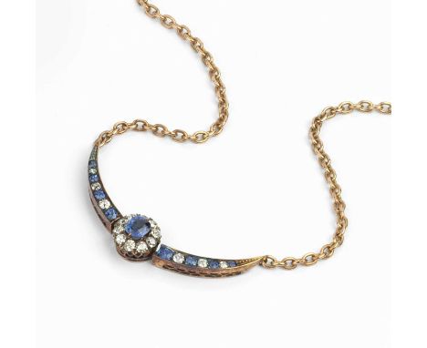 A sapphire and diamond pendant necklace, designed as a crescent-shaped panel with central cluster, the principal cushion-shap