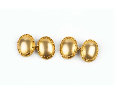 A pair of cufflinks, each oval panel of bloomed finish, applied with ropetwist wirework and beaded borders, on figure-of-eigh