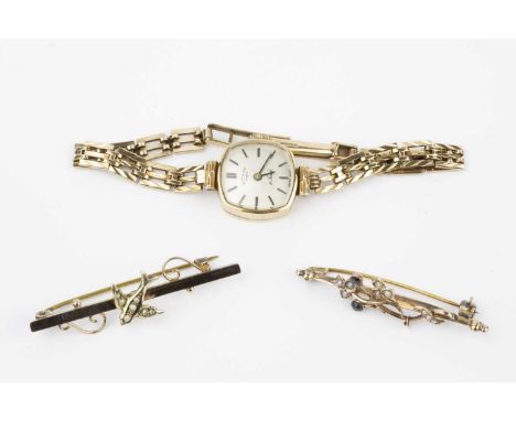 A lady's 9ct gold bracelet watch by Rotary, the cushion-shaped silvered dial with baton markers, to a jewelled manual wind mo