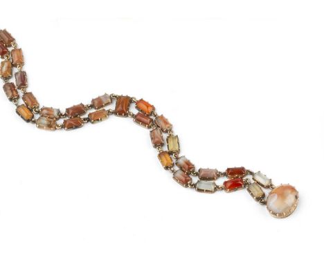 A 19th century agate panel bracelet, designed as two rows of agate batons in pinched collet settings, to a similarly set oval