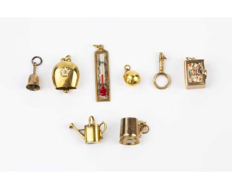A collection of pendants and charms, to include a 9ct gold mounted thermometer, a 9ct gold mounted deck of cards, a 9ct gold 