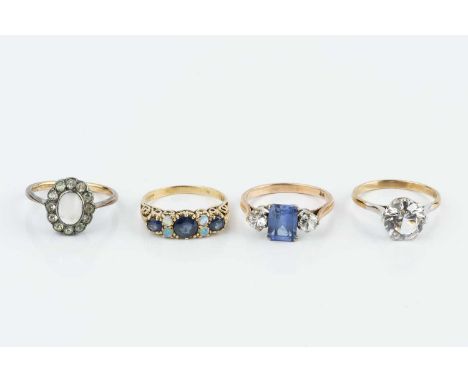 A sapphire and opal half hoop ring, alternately set with circular mixed-cut sapphires and cabochon opals, 9ct gold mounted, t