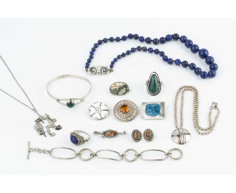 A collection of jewellery, comprising a lapis lazuli single strand bead necklace, with white metal panel clasp modelled as a 