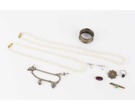 A collection of jewellery, to include a cultured pearl single strand necklace by Mikimoto, the openwork ribbon bow clasp sign