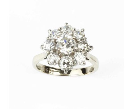 A diamond cluster ring, the flowerhead cluster of graduated old-cut diamonds in claw setting, white precious metal mounted, s