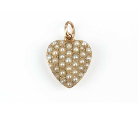A late Victorian/Edwardian half pearl heart pendant, pavé set with graduated half pearls (untested for origin), gold mounted,