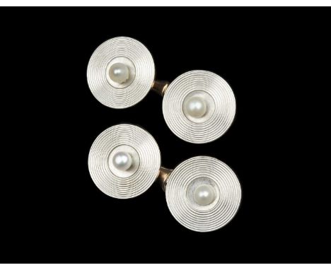 Of Ian Fleming interest: A pair of cultured pearl set cufflinks, each circular panel with radial decoration, centred with a c