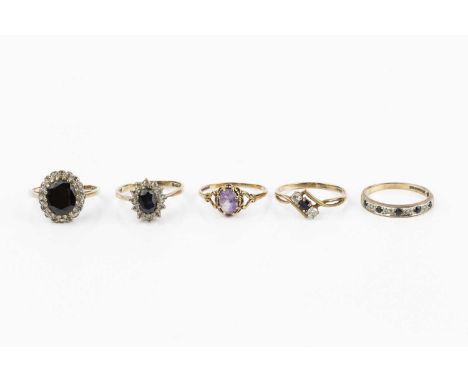 Five gem set dress rings, comprising a sapphire and diamond half hoop eternity ring, 9ct gold mounted, two sapphire and white