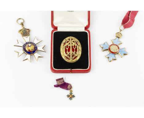 A collection of medals, comprising an enamel Order of St. Michael &amp; St. George, a George V OBE, with dress miniature, and