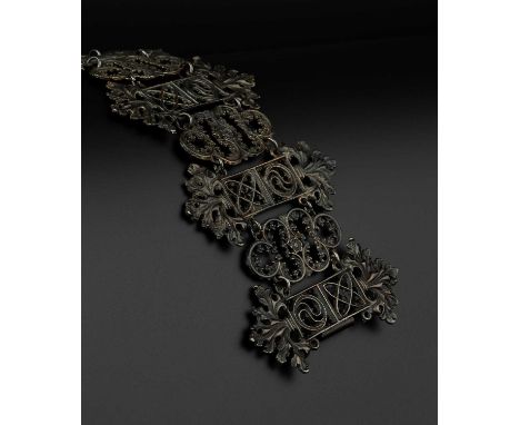 A 19th century Berlin ironwork panel bracelet, designed as a series of alternating foliate and Gothic Revival tracery panels,