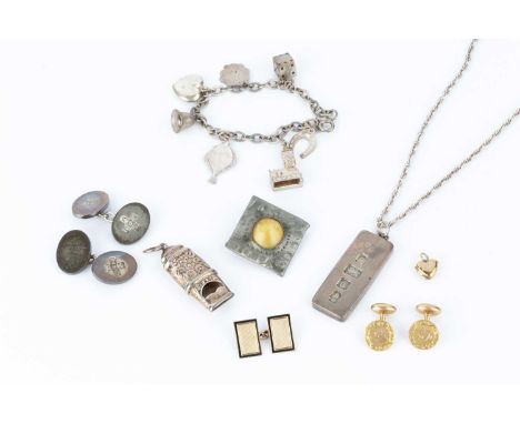 A collection of jewellery, comprising a pair of cufflinks, each circular panel with foliate scroll engraved border, on fixed 