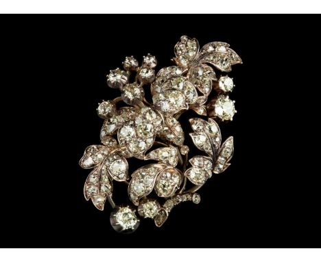 A 19th century diamond floral spray brooch, the tiered panel designed as a stylised flowerhead amongst a spray of foliage, pa