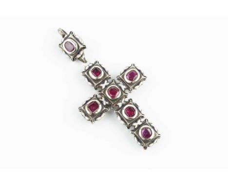 A ruby and enamel cross pendant, heightened with white, blue and black enamel, the intersecting lines of cushion-shaped table