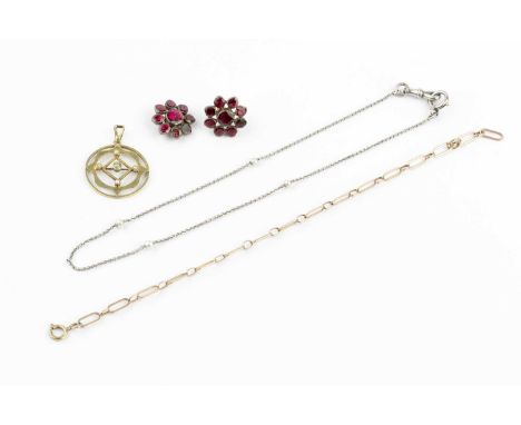 A peridot and half pearl pendant, the circular openwork panel centred with a circular mixed-cut peridot, bordered by half pea