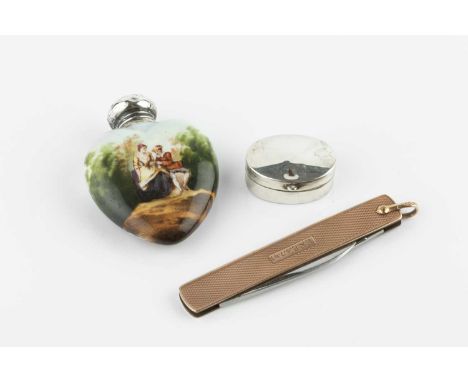 A nine carat gold penknife, with engine turned decoration, and steel blade, 7.5cm, an Edwardian silver topped ceramic heart s