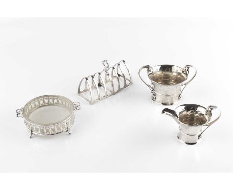 A collection of silver, comprising a seven bar toast rack, by Selfridge &amp; Co., Birmingham 1929, a pierce decorated butter